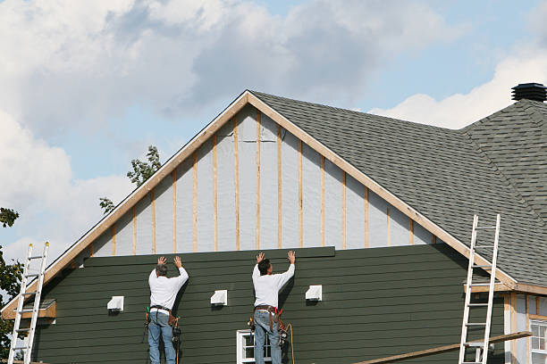Professional Vinyl Siding technician working in Ault, CO
